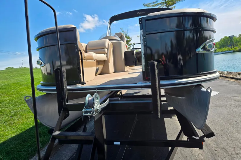 Slide: The Image of 2017 Bentley Pontoons 220 Elite Admiral on trailer by a lake. - 7