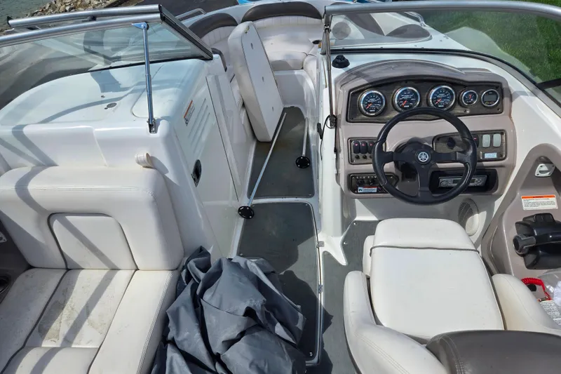 Slide: The Image of 2007 Yamaha Boats SX230 HO interior with steering wheel, gauges, and seating. - 11