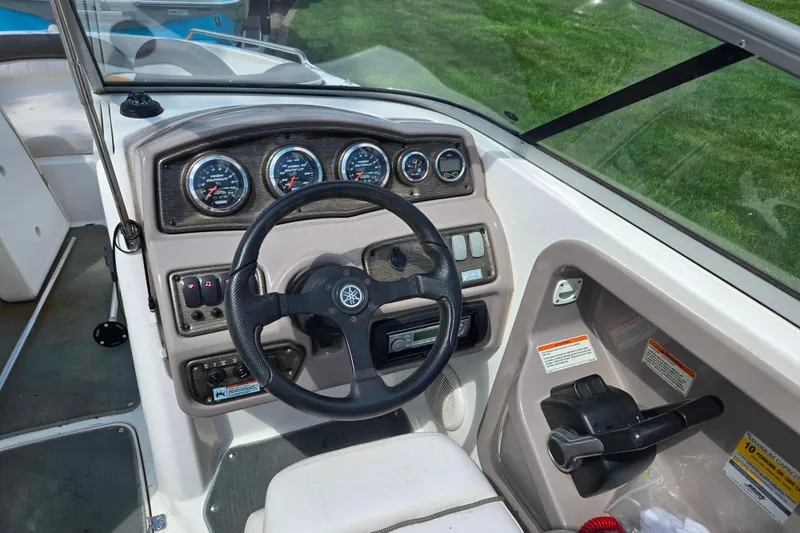 Slide: The Image of 2007 Yamaha Boats SX230 HO dashboard with steering wheel and instrument panel. - 12