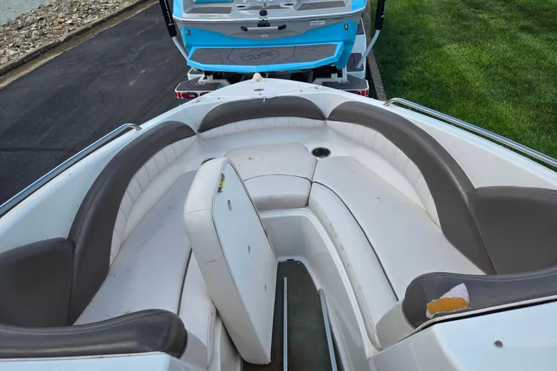 Slide: The Image of 2007 Yamaha Boats SX230 HO interior with cushioned seating and storage compartment. - 16