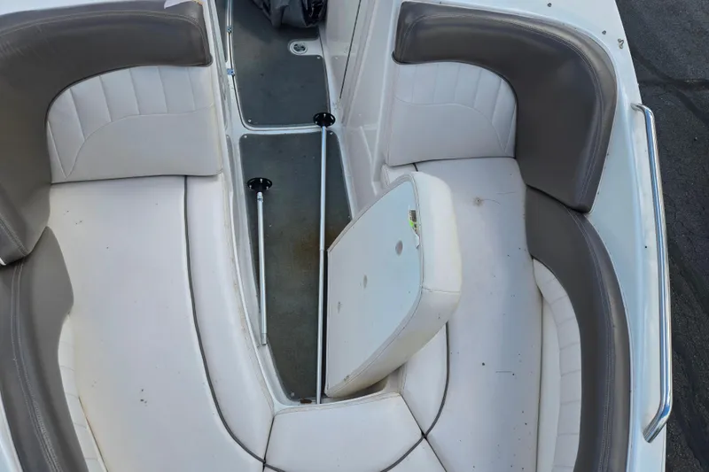 Slide: The Image of 2007 Yamaha Boats SX230 HO interior seating with white and gray upholstery. - 18