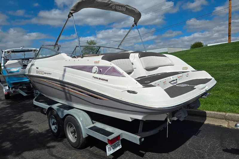Slide: The Image of 2007 Yamaha Boats SX230 HO on trailer, featuring twin engines and sleek design. - 3