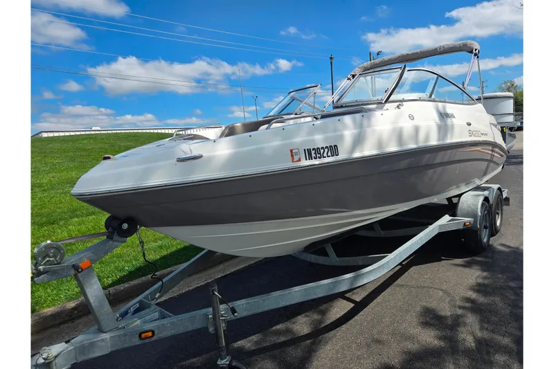 Slide: The Image of 2007 Yamaha Boats SX230 HO on trailer, parked outdoors under blue sky. - 5