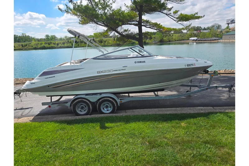 Slide: The Image of 2007 Yamaha Boats SX230 HO on trailer by a scenic lake. - 9