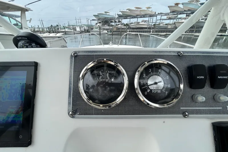 Slide: The Image of Dashboard of a 2022 Boston Whaler 190 Montauk boat with gauges and controls. - 20