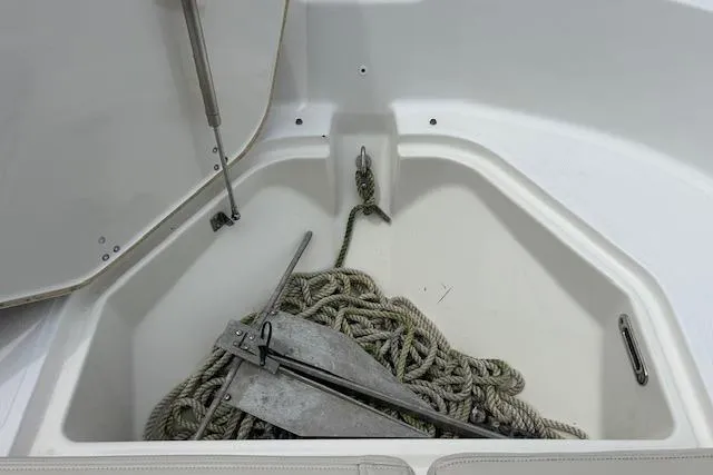 Slide: The Image of Anchor and rope storage in 2022 Boston Whaler 190 Montauk boat compartment. - 28