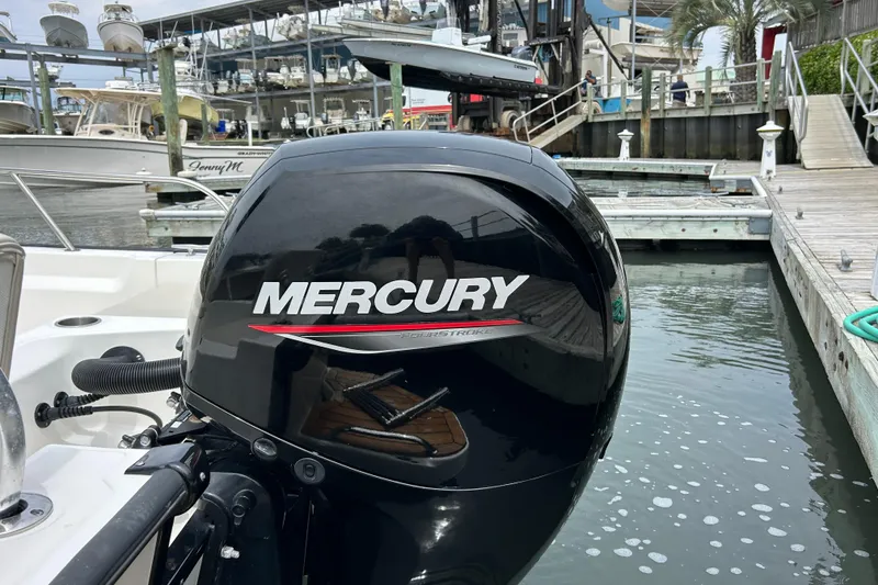 Slide: The Image of Mercury outboard motor on 2022 Boston Whaler 190 Montauk at marina dock. - 8