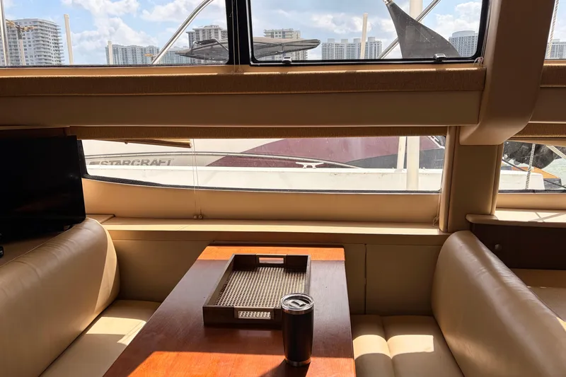 Slide: The Image of Interior view of a 2005 Meridian 368 Motoryacht with cityscape through windows. - 10