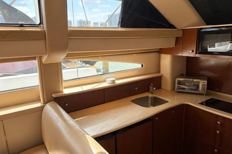 Slide: The Image of Interior of 2005 Meridian 368 Motoryacht kitchen with sink, microwave, and toaster oven. - 13