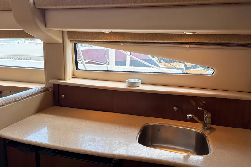 Slide: The Image of Interior of 2005 Meridian 368 Motoryacht with sink and window view. - 14