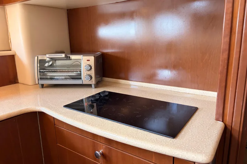 Slide: The Image of Kitchen area of 2005 Meridian 368 Motoryacht with toaster oven and stovetop. - 15