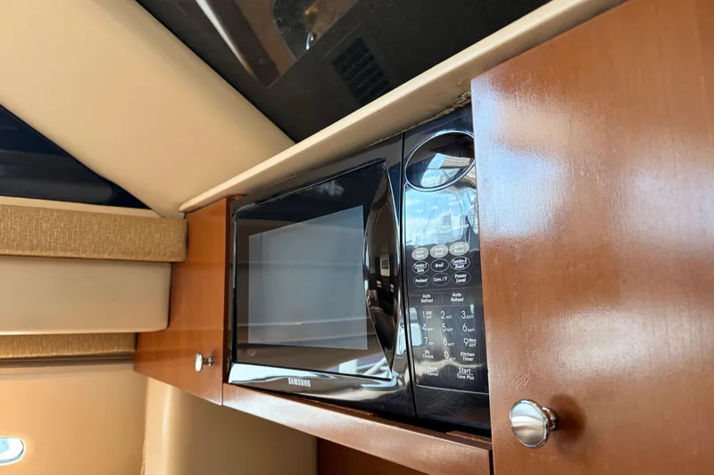 Slide: The Image of Microwave in 2005 Meridian 368 Motoryacht kitchen, set in wooden cabinetry. - 16