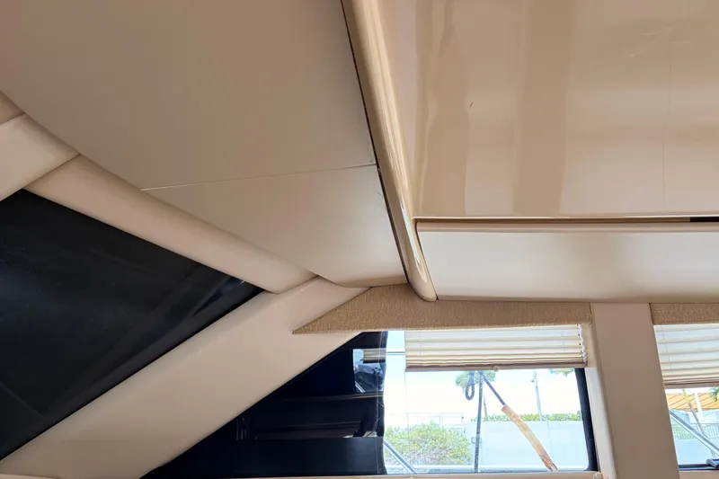 Slide: The Image of Interior view of 2005 Meridian 368 Motoryacht, showcasing sleek design and window details. - 17