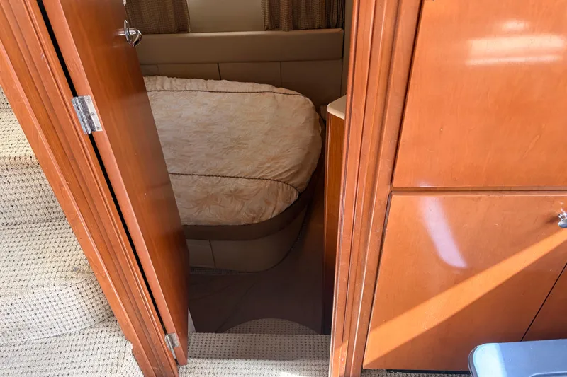Slide: The Image of Interior cabin view of a 2005 Meridian 368 Motoryacht with wooden door and bed. - 18