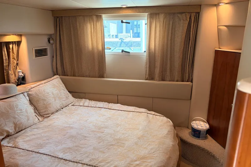 Slide: The Image of Luxurious bedroom interior of 2005 Meridian 368 Motoryacht with cozy bedding and window view. - 19
