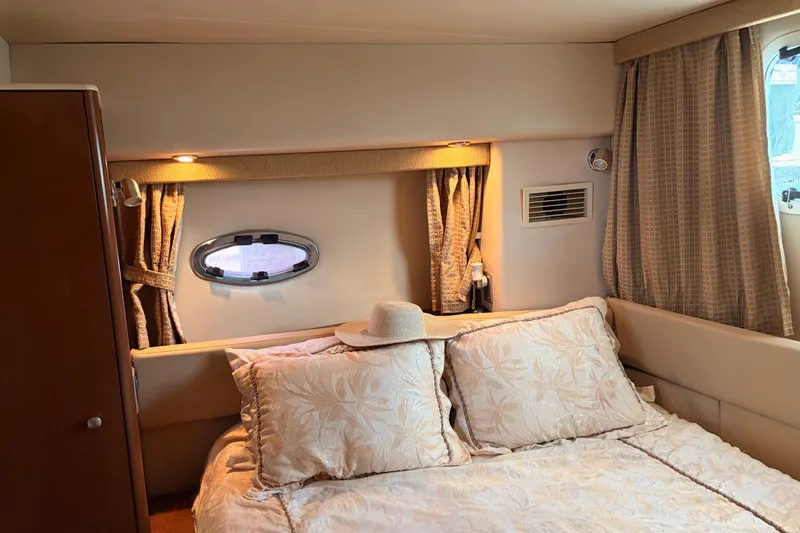 Slide: The Image of Cozy bedroom interior of 2005 Meridian 368 Motoryacht with elegant bedding and soft lighting. - 20