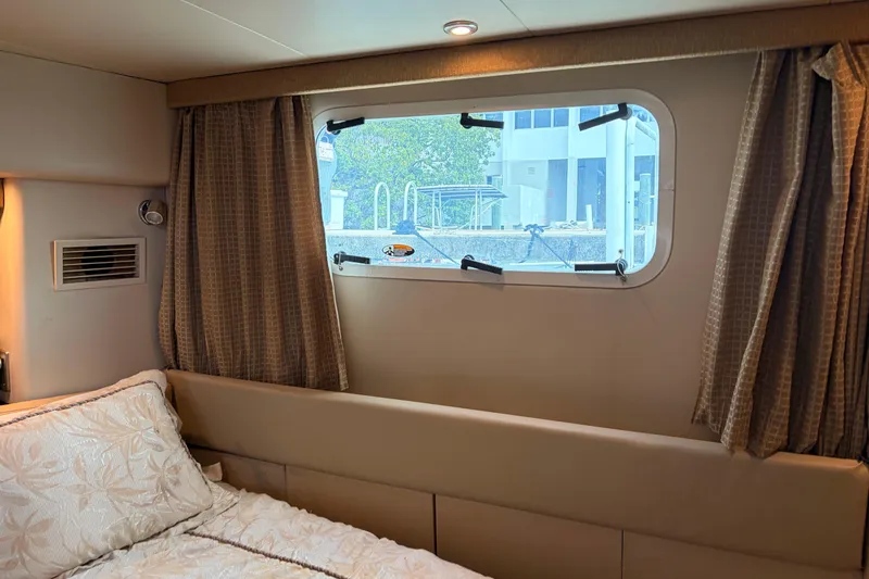 Slide: The Image of Interior cabin of 2005 Meridian 368 Motoryacht with window and bed. - 21