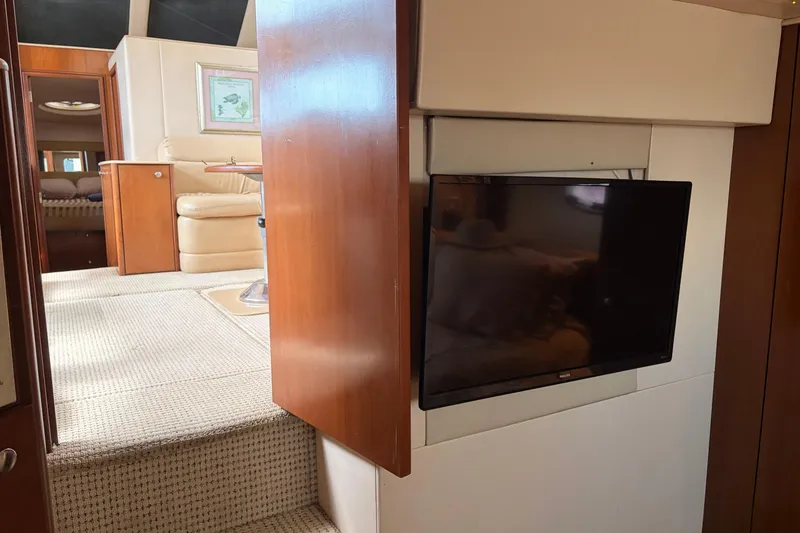 Slide: The Image of Interior of 2005 Meridian 368 Motoryacht with TV and beige seating area. - 22