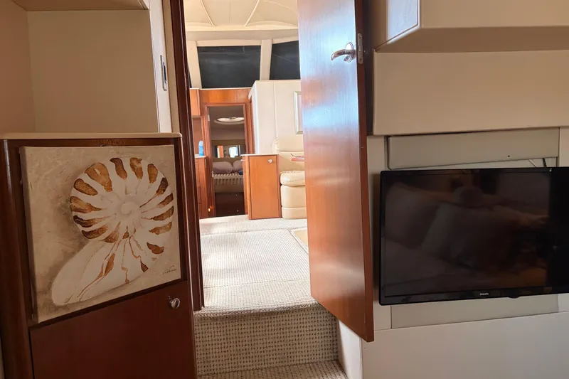 Slide: The Image of Interior of 2005 Meridian 368 Motoryacht with TV and decorative shell art. - 23