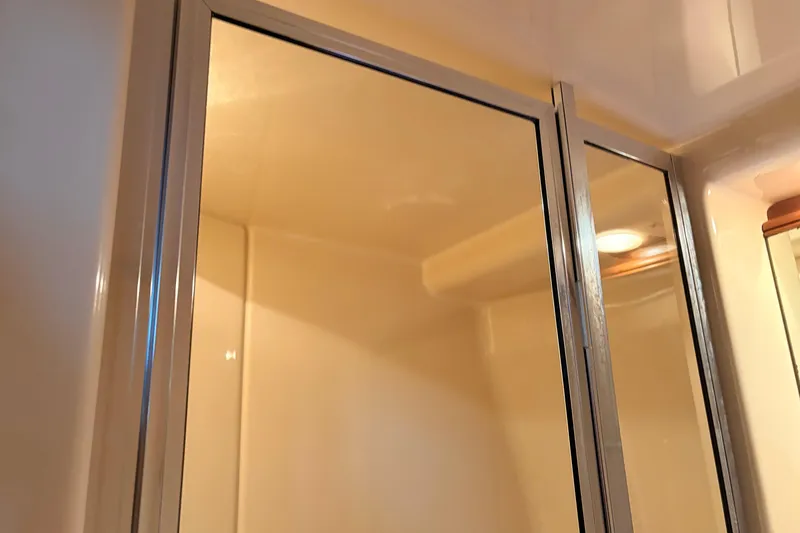 Slide: The Image of Shower area inside 2005 Meridian 368 Motoryacht, featuring sleek glass doors and modern design. - 25