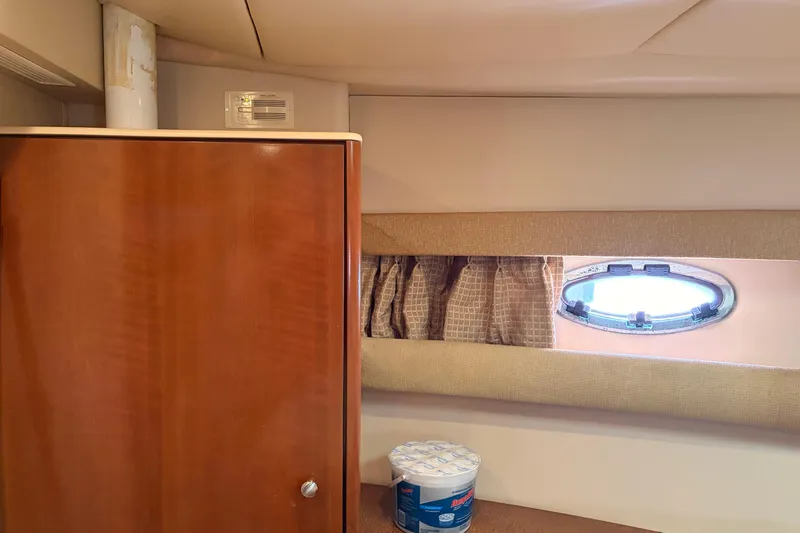 Slide: The Image of Interior of 2005 Meridian 368 Motoryacht with wooden cabinet and porthole window. - 29