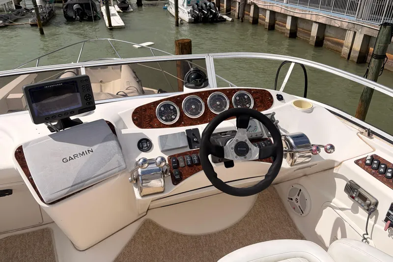Slide: The Image of Cockpit of 2005 Meridian 368 Motoryacht with Garmin navigation system and steering controls. - 33