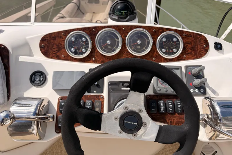 Slide: The Image of Steering console of 2005 Meridian 368 Motoryacht with gauges and controls. - 34