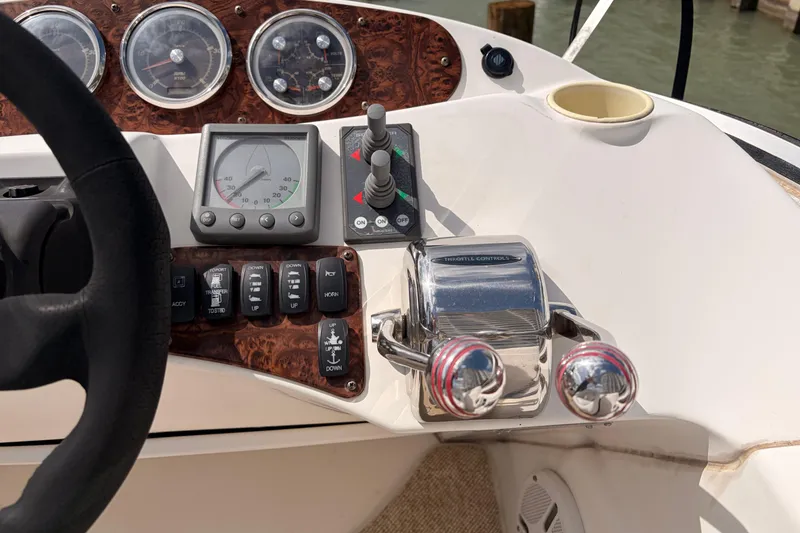 Slide: The Image of Control panel of 2005 Meridian 368 Motoryacht with gauges and throttle controls. - 37