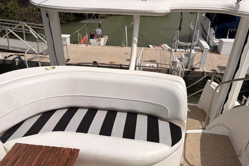 Slide: The Image of 2005 Meridian 368 Motoryacht with striped seating at a marina dock. - 41