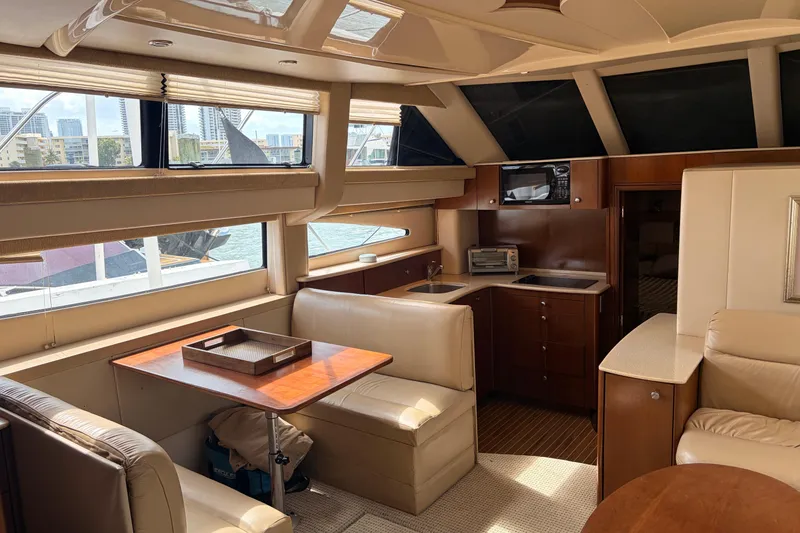 Slide: The Image of Luxurious interior of a 2005 Meridian 368 Motoryacht with dining and kitchen area. - 5