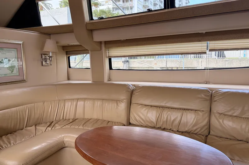 Slide: The Image of Luxurious interior of 2005 Meridian 368 Motoryacht with leather seating and wooden table. - 6