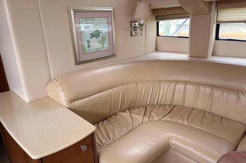 Slide: The Image of Luxurious interior of 2005 Meridian 368 Motoryacht with beige leather seating and framed artwork. - 8