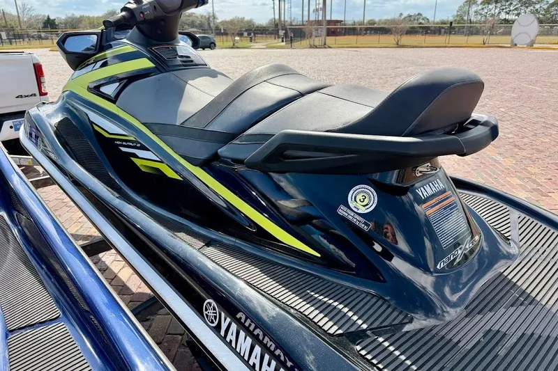 Slide: The Image of 2019 Yamaha WaveRunner VX Deluxe jet ski on a trailer, parked outdoors. - 10