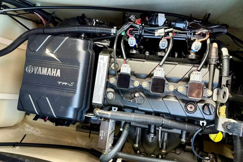 Slide: The Image of Engine compartment of a 2019 Yamaha WaveRunner VX Deluxe, showcasing the TR-1 engine components. - 13