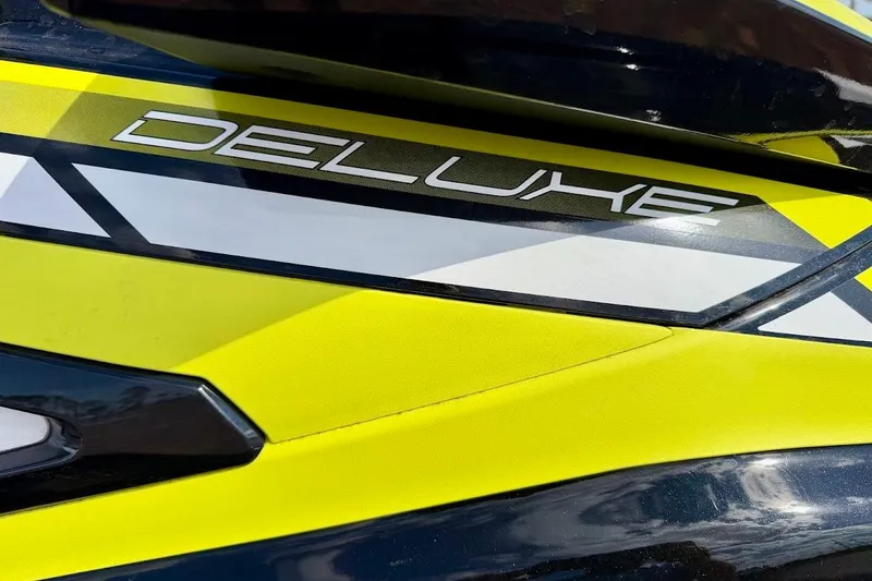 Slide: The Image of Close-up of 2019 Yamaha WaveRunner VX Deluxe with vibrant yellow and black design. - 6