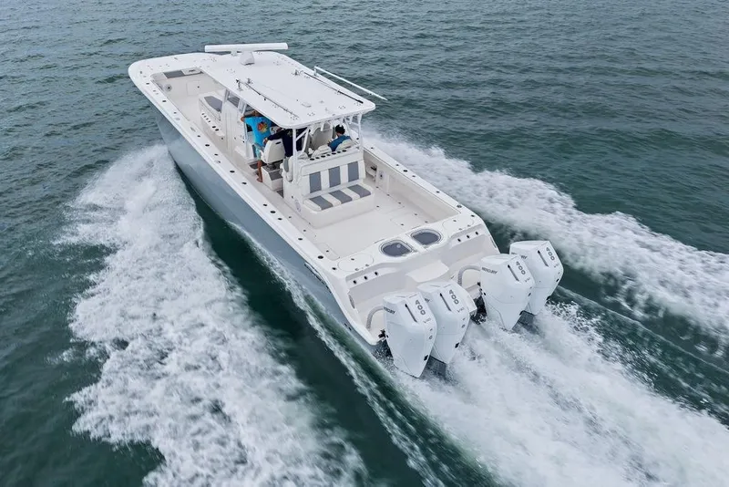 Slide: The Image of Invincible 46 Catamaran 2021 cruising on open water with powerful engines. - 12