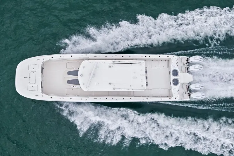Slide: The Image of Aerial view of 2021 Invincible 46 Catamaran cruising on open water. - 13