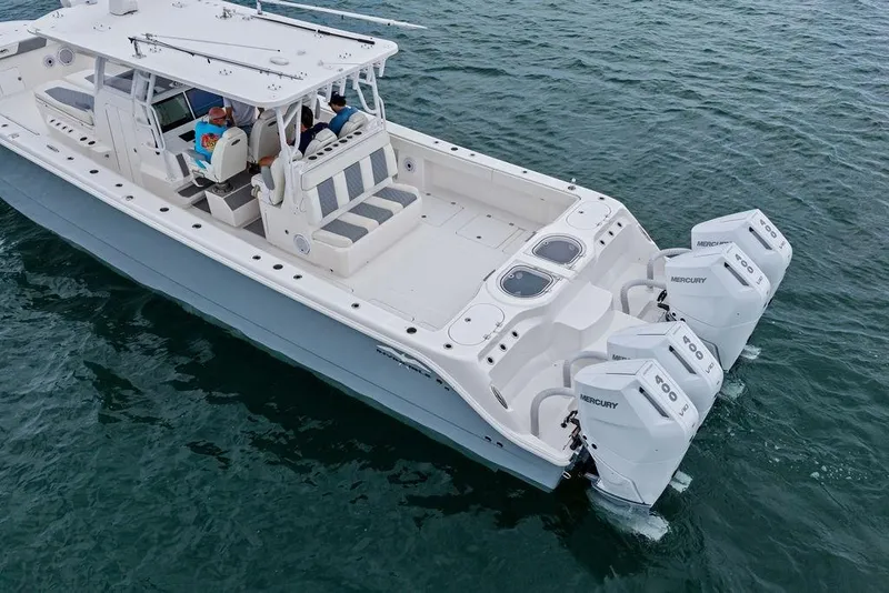 Slide: The Image of 2021 Invincible 46 Catamaran with Mercury engines on open water. - 16