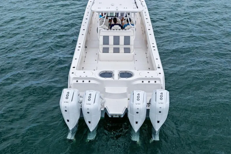 Slide: The Image of Invincible 46 Catamaran 2021 with quad 400 V10 engines on open water. - 17