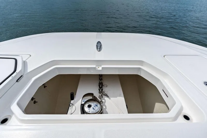 Slide: The Image of Anchor compartment of 2021 Invincible 46 Catamaran, open on calm water. - 20