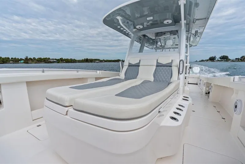 Slide: The Image of 2021 Invincible 46 Catamaran with luxurious seating on open water. - 26