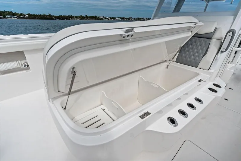Slide: The Image of Open storage compartment on 2021 Invincible 46 Catamaran, featuring sleek design and ample space. - 28