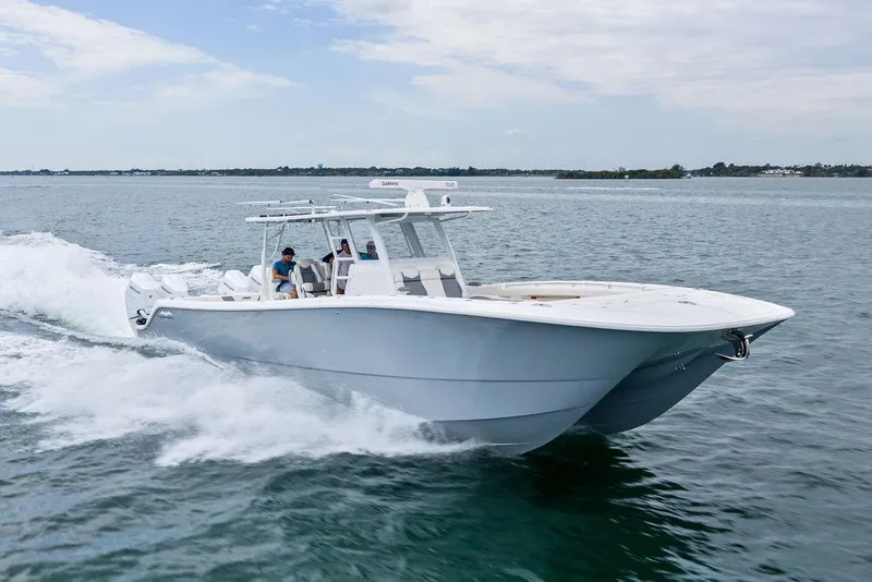Slide: The Image of 2021 Invincible 46 Catamaran cruising on open water, showcasing sleek design and performance. - 3