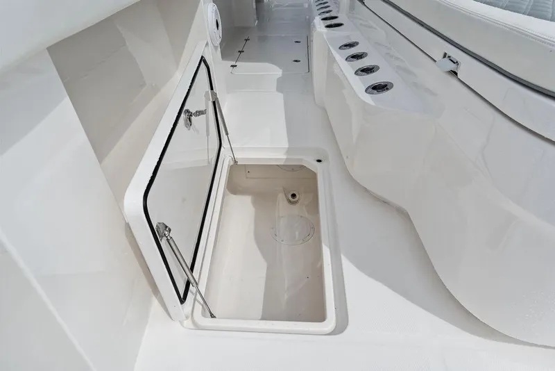 Slide: The Image of Open storage compartment on 2021 Invincible 46 Catamaran deck, showcasing sleek design. - 30