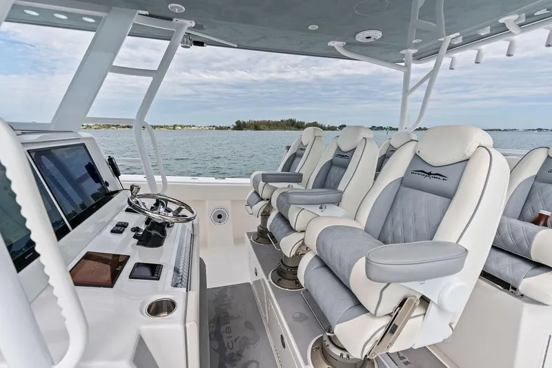 Slide: The Image of Interior of 2021 Invincible 46 Catamaran with luxury seating and navigation controls. - 33