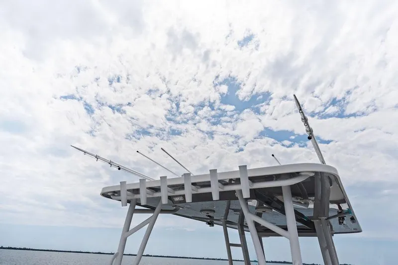 Slide: The Image of Rooftop view of 2021 Invincible 46 Catamaran against a cloudy sky. - 38