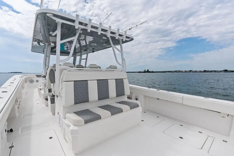 Slide: The Image of 2021 Invincible 46 Catamaran on open water, featuring spacious seating and sleek design. - 39
