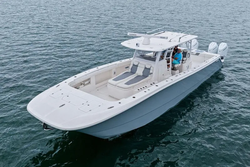 Slide: The Image of Invincible 46 Catamaran 2021 on open water, showcasing sleek design and powerful engines. - 9