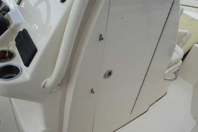 Slide: The Image of 2023 Grady-White Fisherman 236 boat console with cup holders and storage compartment. - 14