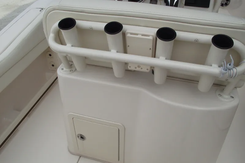Slide: The Image of 2023 Grady-White Fisherman 236 boat rod holders and storage compartment. - 20